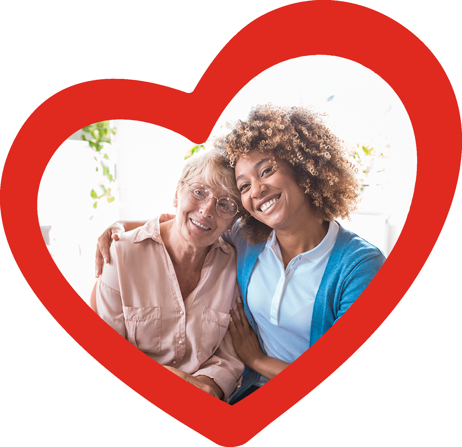 A home care provider and woman posing for a photo, smiling at the camera